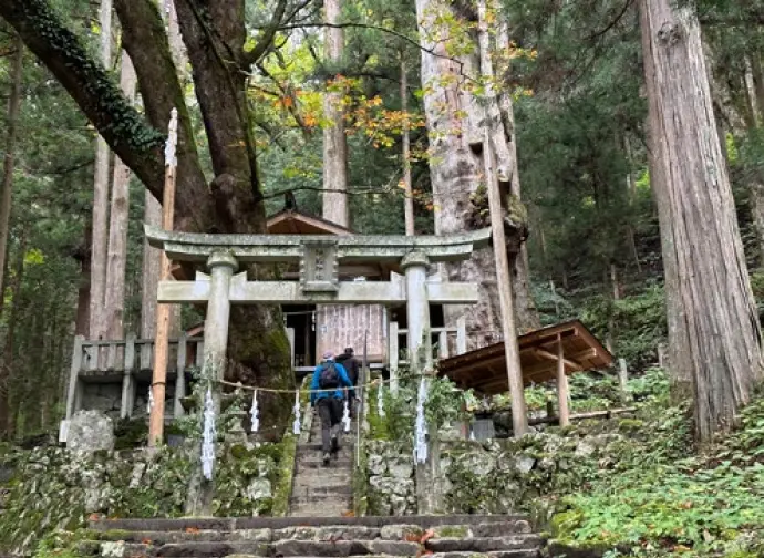 Two men visiting a shrine.