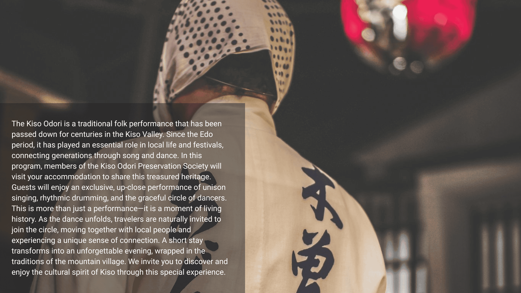 A Kiso Odori performer seen from behind, wearing traditional attire during a cultural dance performance